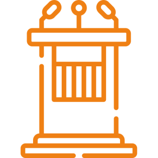 Orange podium with microphones on black background.