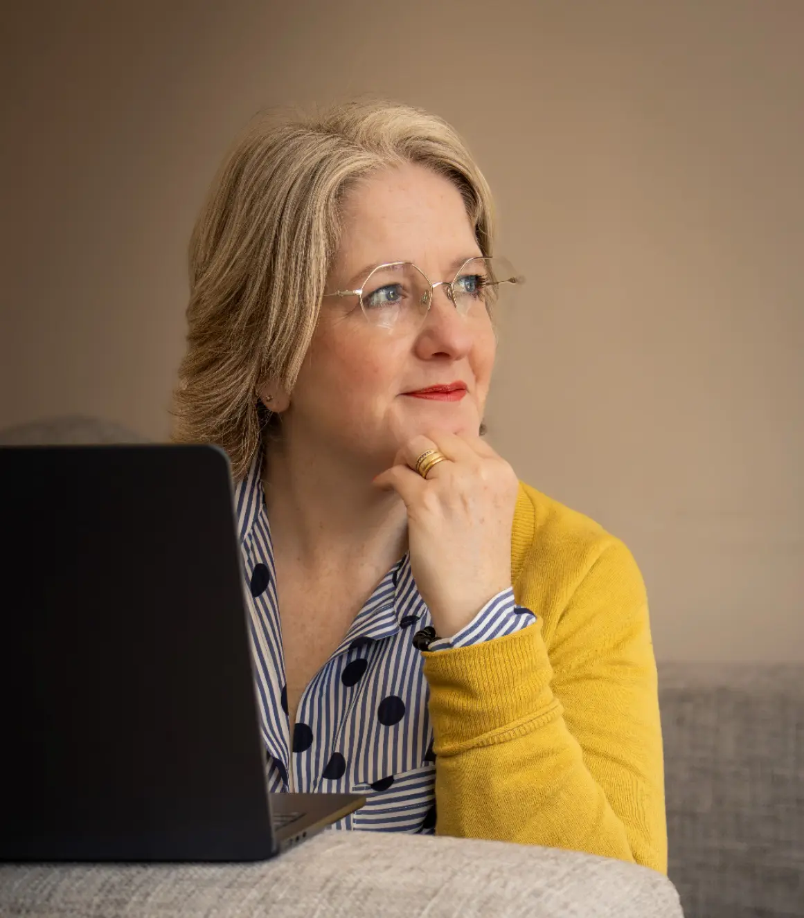 A woman sitting in front of a laptop computer.